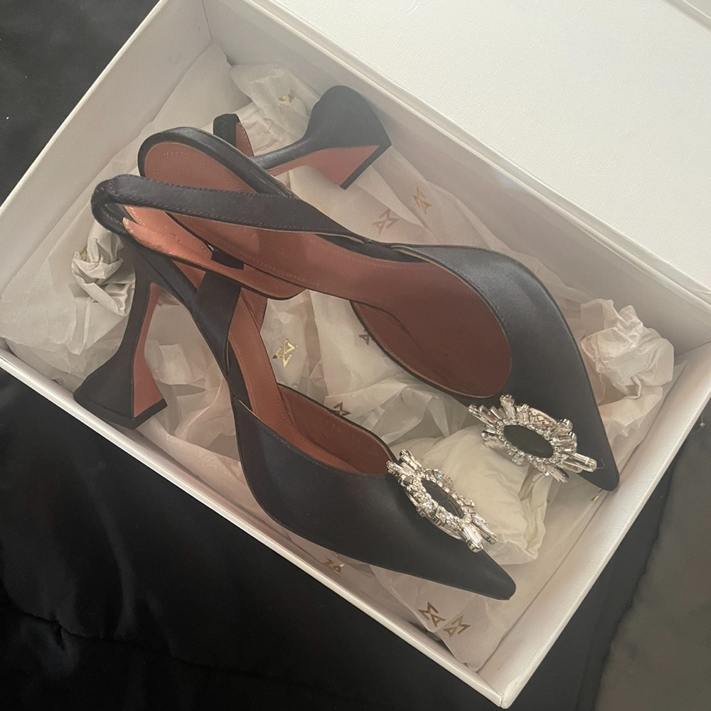 Amina Muaddi black sling backs